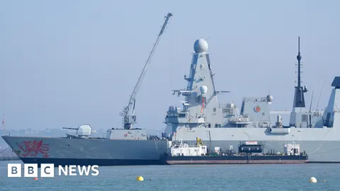 HMS Dragon Deploys to Hormuz as Toman Hits 177,900 Amid 'Unsustainable' Naval Standoff