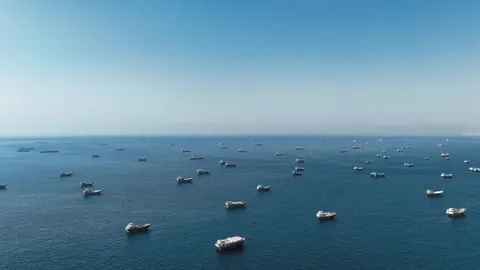 Hormuz Drone Clash Triggers USD Spike; Smoke Clouds Putin’s Economic Forum; EV Tariff Crisis Looms in Europe