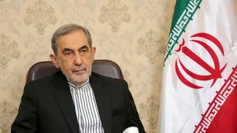 Velayati Demands Foreign Exit from West Asia as Emami Coin Surges 1.4% Amid Regional Tension