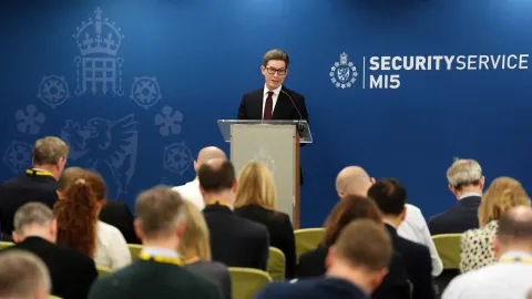 MI5 Chief Flags Growing Iranian & Russian Threats; Toman Strengthens as Gold Dips