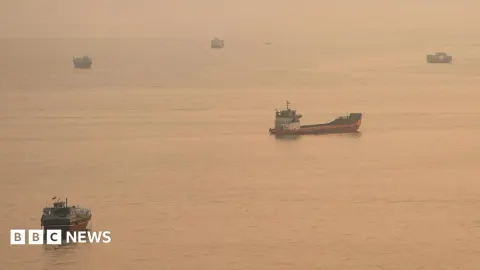 Strait of Hormuz Tensions Escalate as Ship Sinks; Iran Signals Negotiation Stance