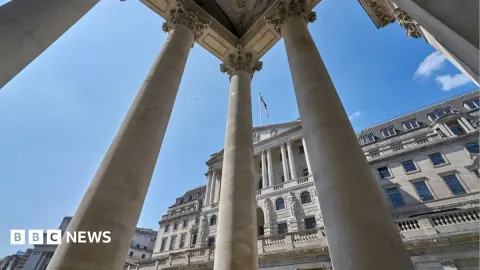 Bank of England Faces Inflation Dilemma as Bitcoin Holds $76,000 Despite Fed Rate Hike